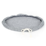 A large sized Plat Bowl Cover with tied draw string, shown lying flat.