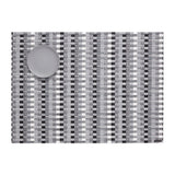 Basketweave of gray, white and black vertical stripes on a flat woven field of subtle gray and white stripes, with a round, medium gray colored dessert plate in the upper left corner.