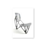 An aluminum chair with skeletal frame and solid aluminum seat and back rest.