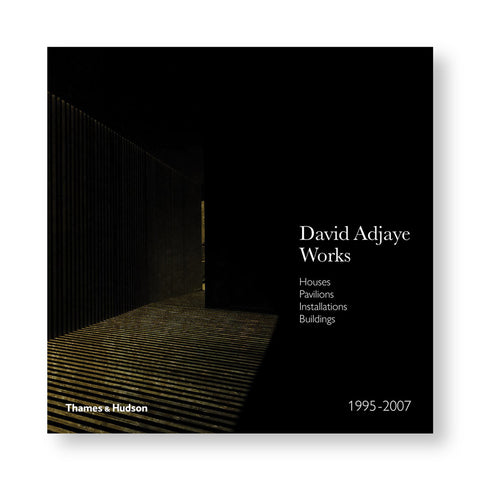 A dark book cover featuring an image of Adjaye's project. Most of the cover is black, the only the floor and the right wall is visible. The title and publisher's logo is designed using white font.  