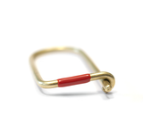 Wilson brass key ring enameled in red.