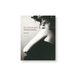 Book cover with black and white photograph of a figure whose back is to us but twisting their head back to us. The figure is wearing a dark lip shade and a lacy dark veil. Title in orange and black font to the left