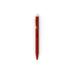 Dark red pen with gold clip and end cap. The tip is retracted, and the metal slide on the face-forward side indicates with a colored circle that the ink will be blue.