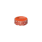 Image of a single role of tape with a red and white marbleized pattern. The Penco logo is printed on a bright orange round sticker that covers the center opening of the roll.