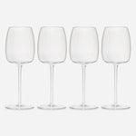 Row of four identical wine glasses, each with a standard base, delicate stem, and slightly flat-bottomed, tulip-shaped bowl.