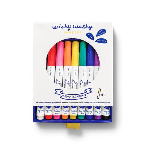 White package with a circle cut-out and blue drawer insert, that holds a row of markers each with a different colored cap.