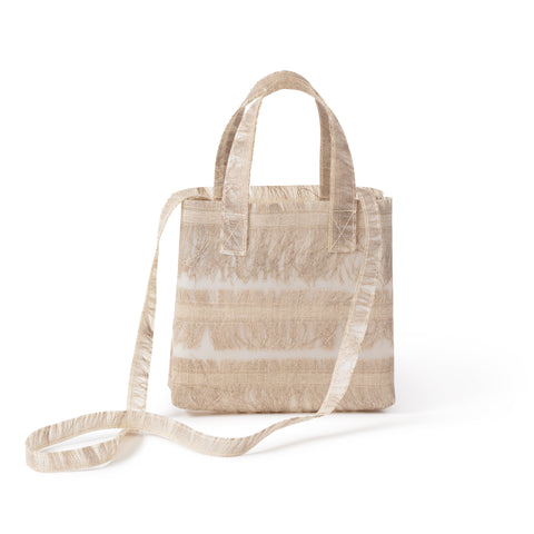 Small translucent tote bag with handles and one long strap, textured with embedded strips of golden-flax colored fringe.