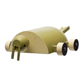 Frontal view of a rollable toy walrus, emphasizing its long wooden tusks,  hand-made from wood and hand-painted in shades of brown with wheels for feet.