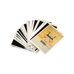 Fanned out hand of Memphis Milano Trading Cards.