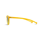 Side view of round framed sunglasses in yellow. The brands logo is embossed on temple arm.