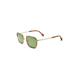 Angled view of a pair of wide framed square sunglasses with green tinted lens and thin metal frame in tortoise. The nose bridge is a light gold color with matching temple arms, which have a tortoise tip.