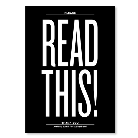 The front of a notebook has the text "READ THIS!" printed in white extra large font on a solid black background.