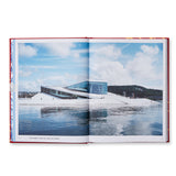 A spread from Snøhetta Collective Intuition that features a large white building that sits at the edge of a body of water. The building resembles a cruise ship and includes several windows that wrap around the building.