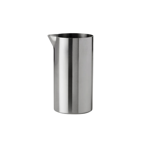 Cylindrical, steel Creamer with a small spout at the top edge. Sides are straight and thin.