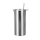 Tall, cylindrical steel martini mixer with a small spout at the top edge, and flat lid that has a mixer protruding from a small opening and a narrow protrusion for flipping the lid open.. 
