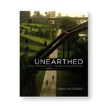 Book cover with photograph of a landscape with deep green grass angular hills and steel bridges. Title overlaid in white sans serif letters