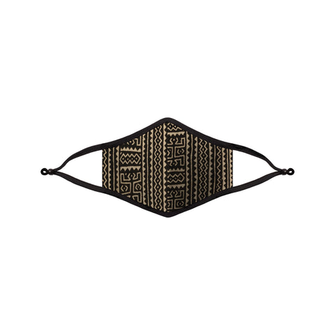 A cloth face masks featuring a black and beige geometric design across its face.