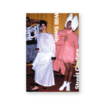 Rectangular book cover featuring a photograph of three fashion models. The two on the right wear oversized garments and headpieces with dramatic makeup while the model on the left wears graphic black-and-white fabric and sunglasses. Overlaid in white is the text "Willi Smith: Street Couture."