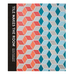 Book cover with textured tessellated pattern in gray blues and pinks. Title vertically printed in white on black spine
