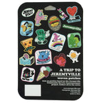 The back side of package showing examples of the available designs. Against a black background the brand name "A Trip to Jeremyville" is embossed at the bottom right corner in white with company details below.
